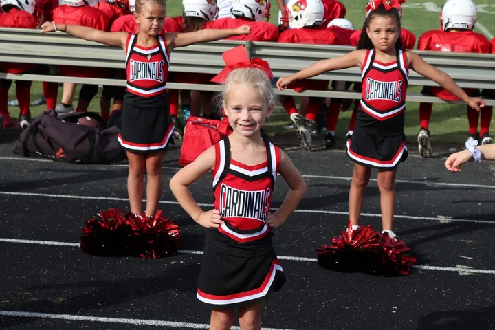 Four Oaks Cardinals cheerleaders on the sideline