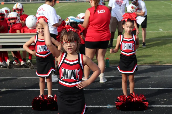 Four Oaks Cardinals cheerleaders on the sideline