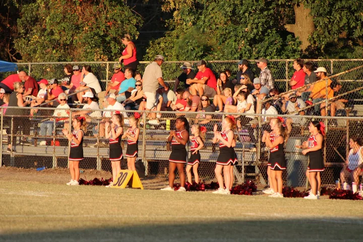 Four Oaks Cardinals cheerleaders on the sideline
