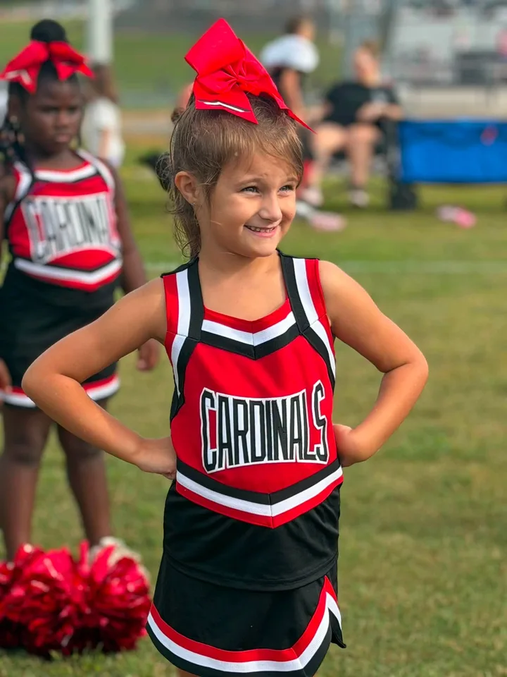 Four Oaks Cardinals cheerleaders on the sideline