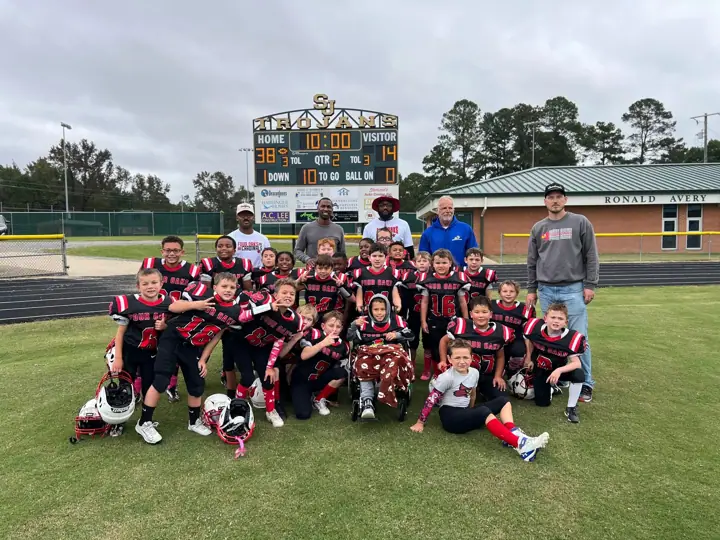 Four Oaks team in full gear on the field