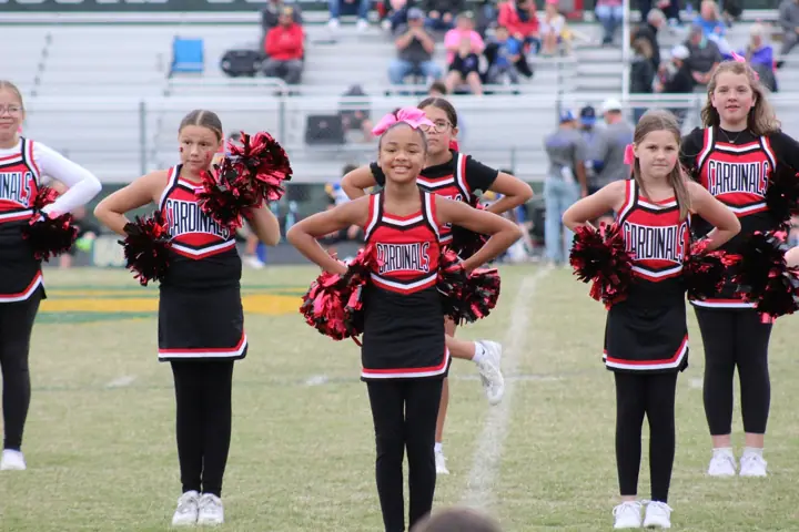 Four Oaks Cardinals cheerleaders on the sideline