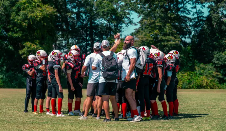 Four Oaks players huddled up with their coaches